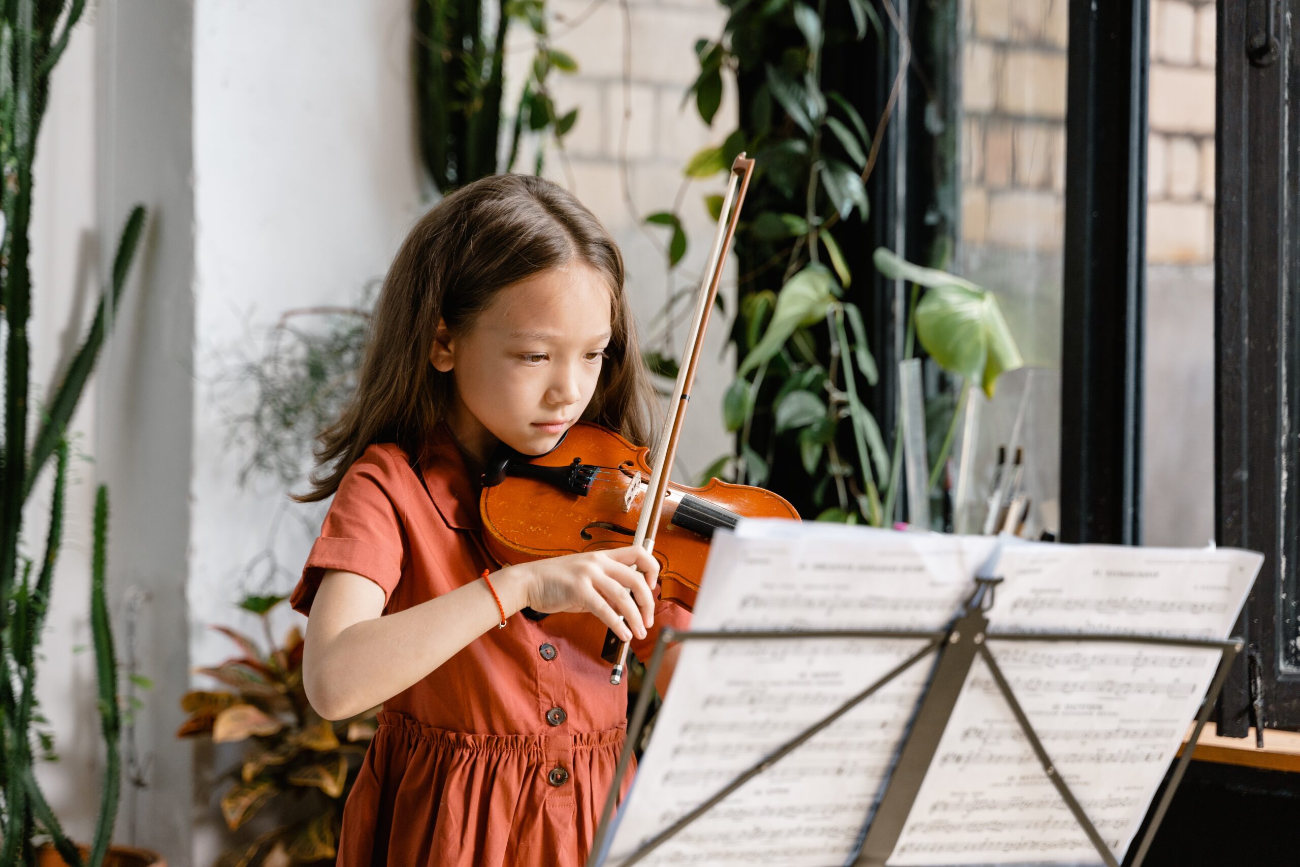 child learning to play violin